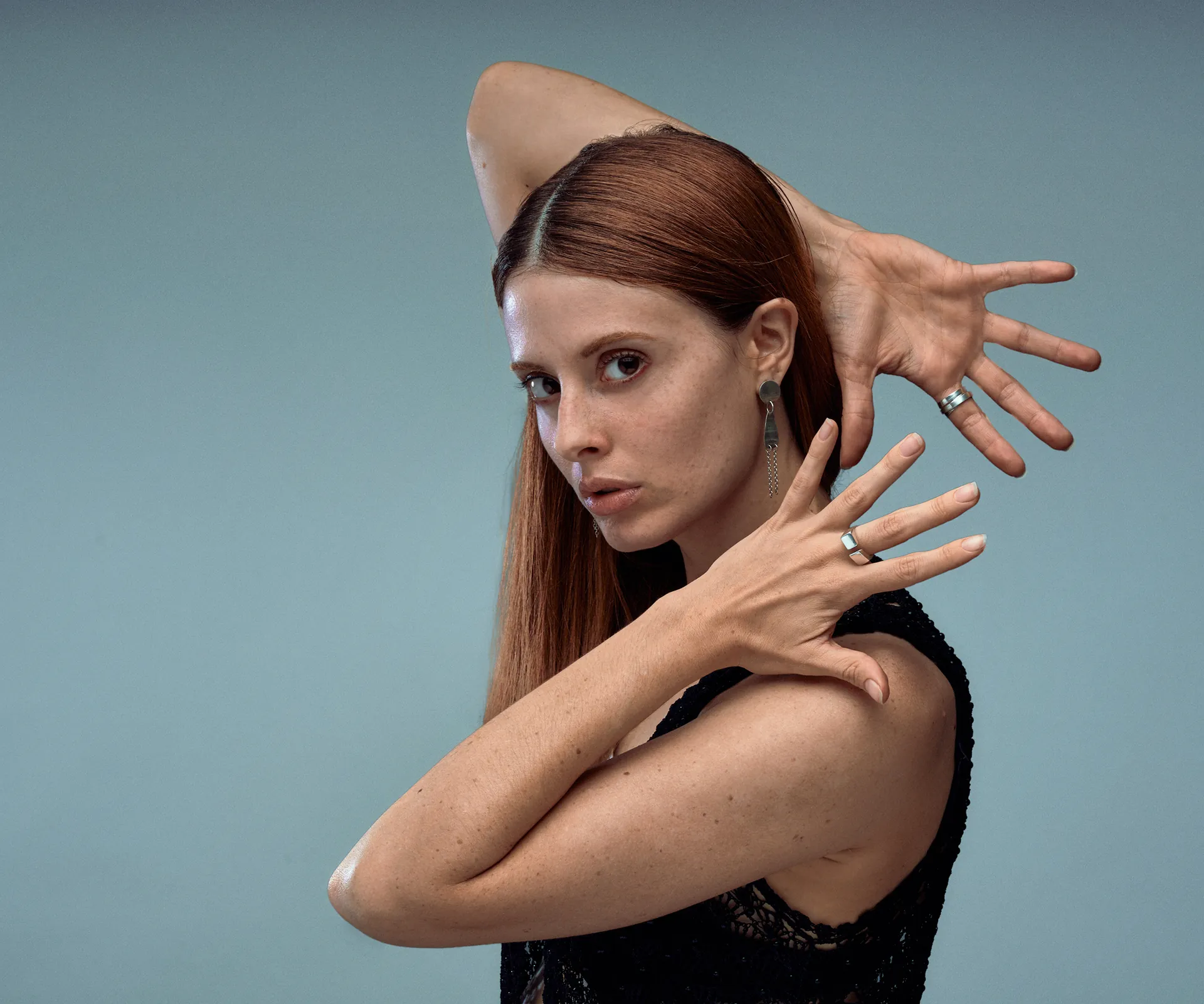 Whisper chapter cover: Indigo handcrafted sterling silver jewelry suspended between stability and tension