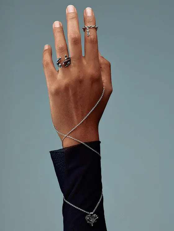 Editorial detail of Indigo Sub-noise sterling silver jewelry, submerged currents shimmering on skin