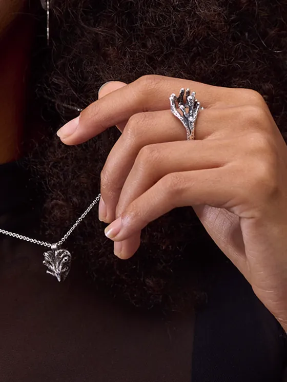 Model wearing handcrafted Indigo silver jewelry from the Sub-noise current tale