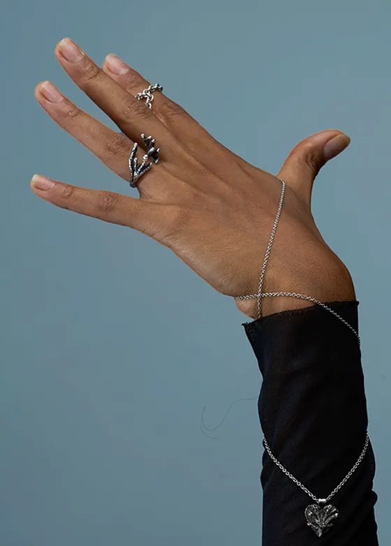 Close-up of Indigo artisan jewelry, an intimate echo transformed into precious silver form